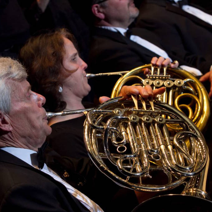 Photo of musicians playing horns